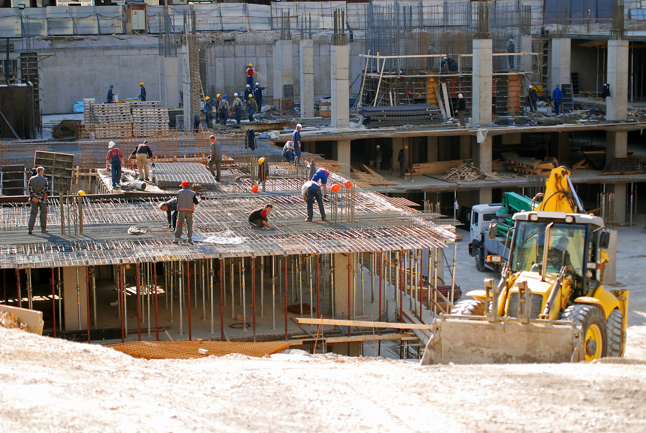 Masonry crew working on a building structure on-site